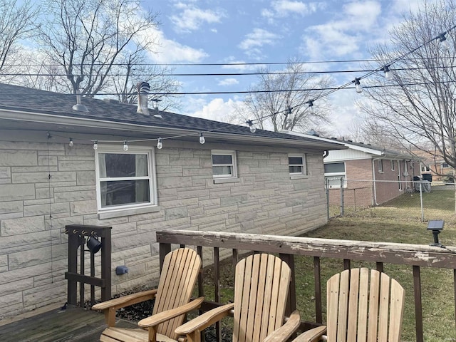 wooden terrace featuring fence