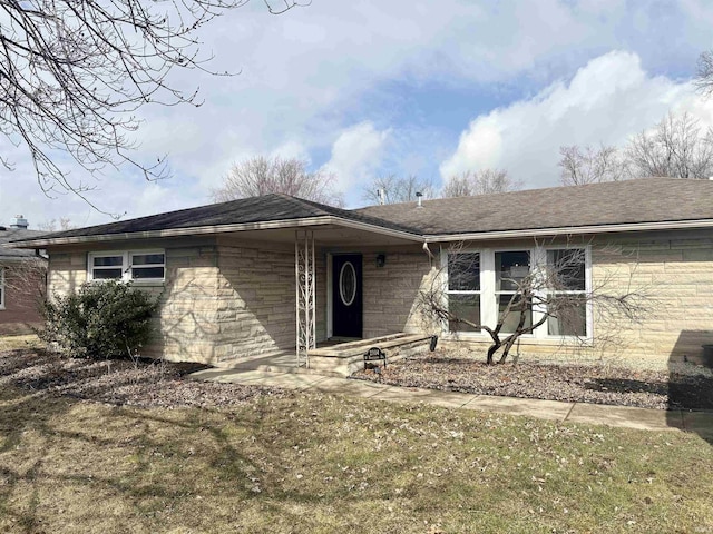 single story home with stone siding