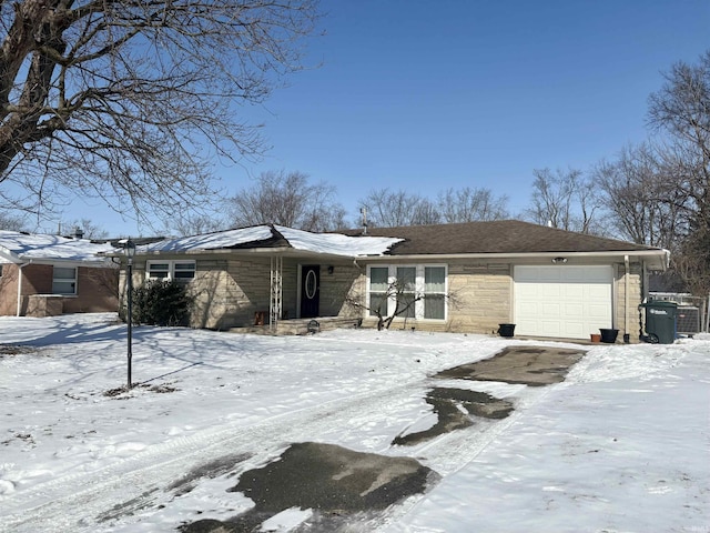 view of front of house with stone siding and an attached garage