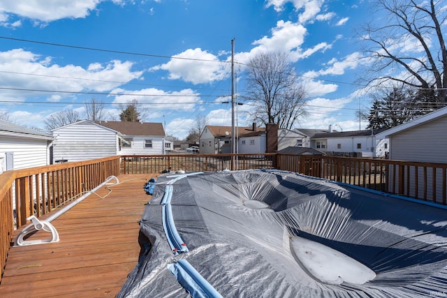 wooden terrace with a residential view