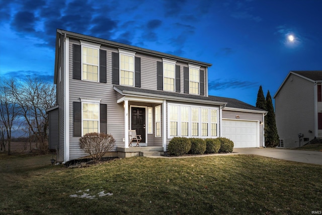 view of front facade featuring driveway, an attached garage, and a front lawn