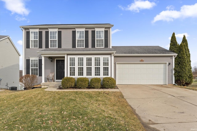 view of front of home with an attached garage, central air condition unit, driveway, and a front lawn