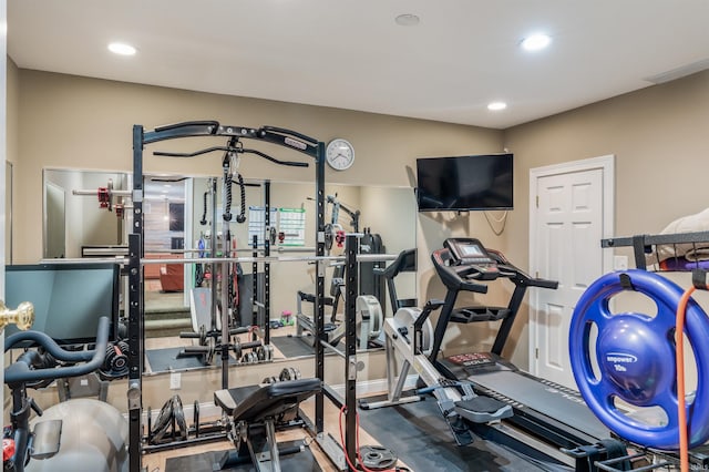 exercise room with recessed lighting