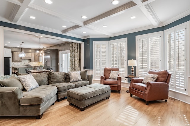 living room featuring ornamental molding, beam ceiling, coffered ceiling, and light wood-style flooring