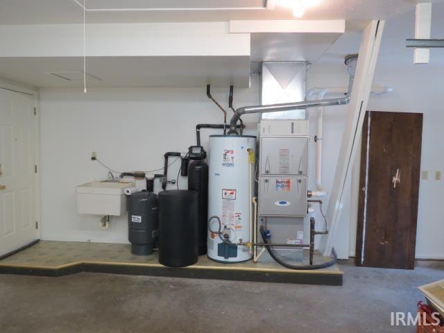 utilities with water heater and a sink