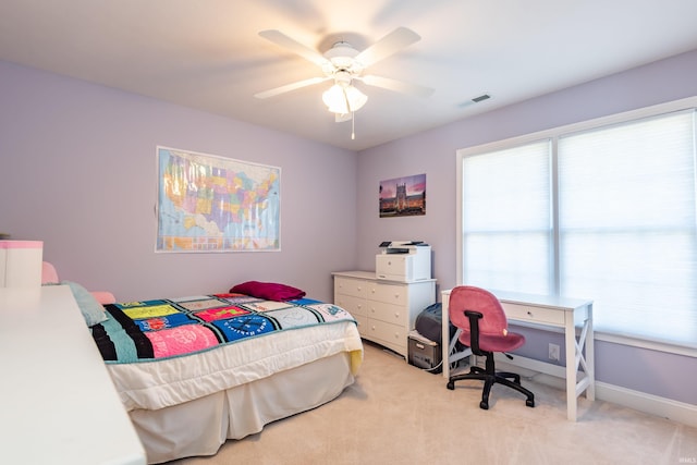 bedroom with visible vents, ceiling fan, light carpet, and baseboards