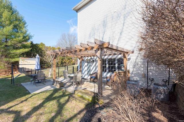 view of yard with fence, central AC unit, a pergola, and a patio