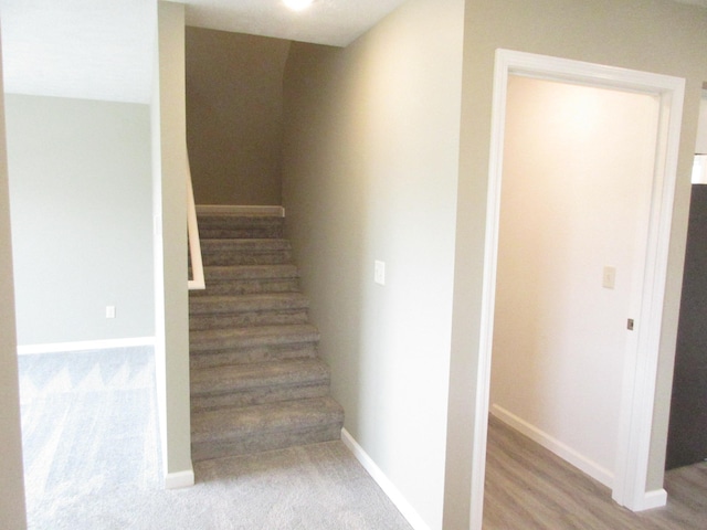 stairs featuring baseboards