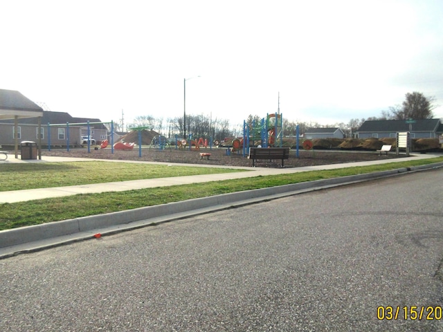 view of road with curbs and sidewalks