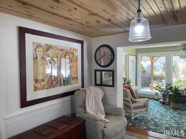 living area featuring wood ceiling