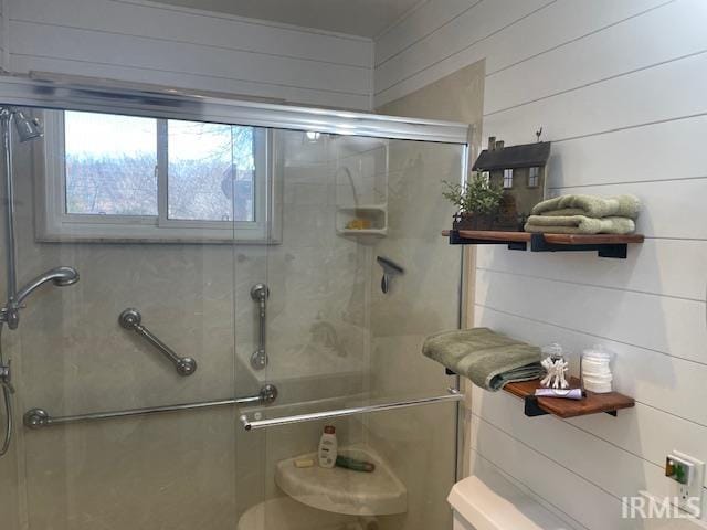 bathroom with a shower stall