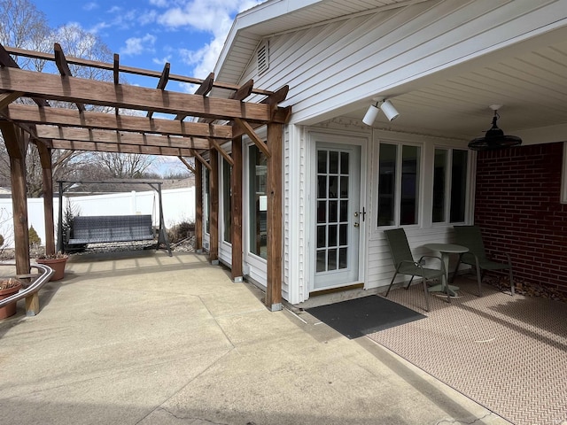 view of patio / terrace with fence and a pergola