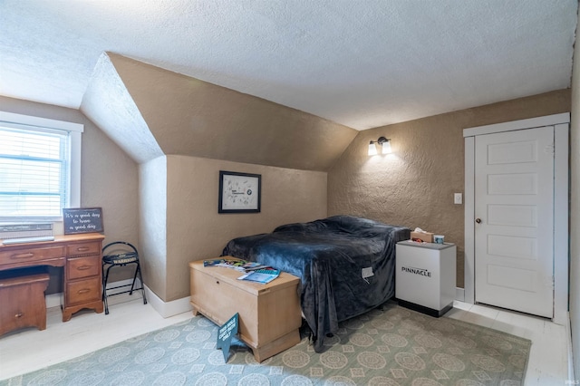 bedroom featuring a textured ceiling, a textured wall, lofted ceiling, and baseboards