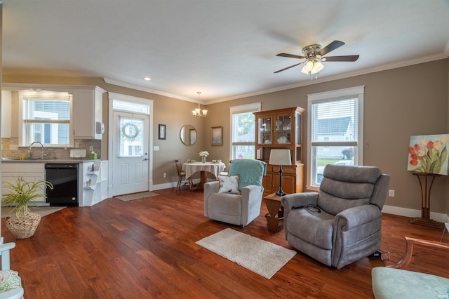 living area with plenty of natural light, baseboards, and dark wood finished floors