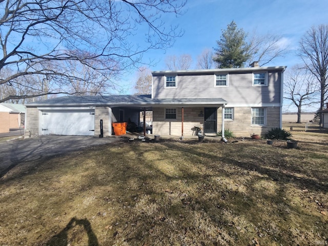 view of front of home featuring driveway, a front lawn, a chimney, and an attached garage