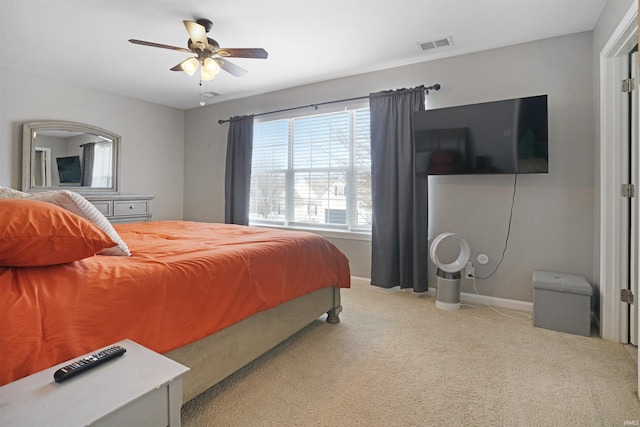 bedroom with a ceiling fan, baseboards, visible vents, and carpet flooring