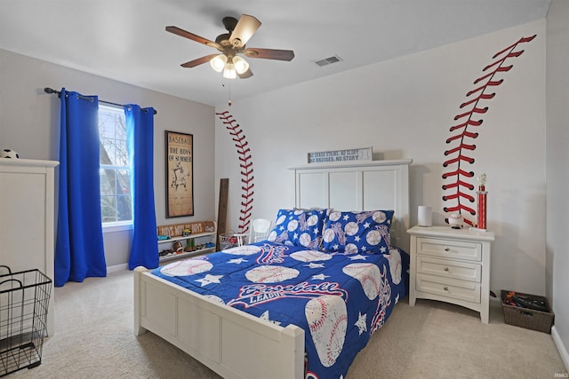 carpeted bedroom featuring ceiling fan and visible vents