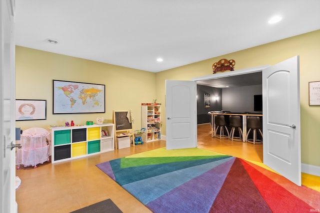 playroom featuring baseboards and recessed lighting