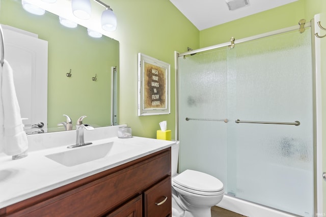 full bath with toilet, a stall shower, visible vents, and vanity