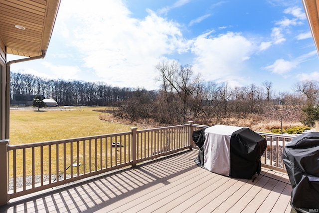 deck featuring a yard and area for grilling