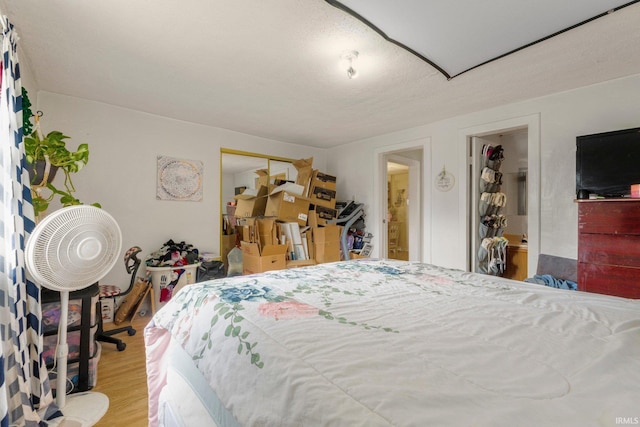 bedroom with a closet and wood finished floors