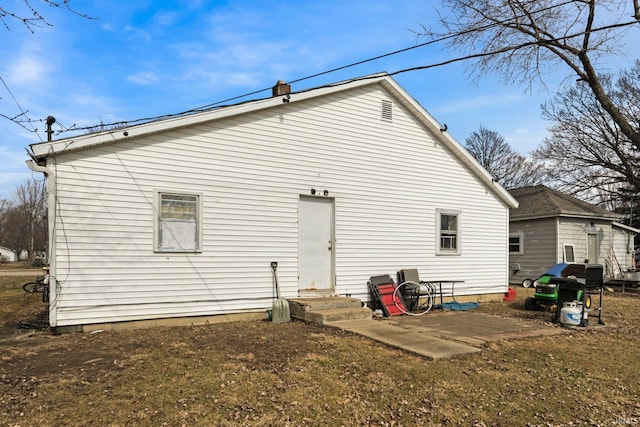 back of property with entry steps