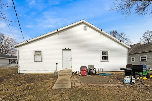 rear view of house featuring a patio