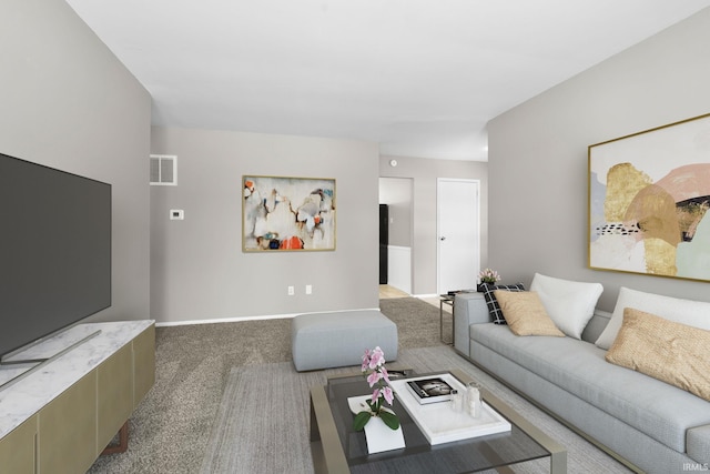 carpeted living area featuring visible vents and baseboards