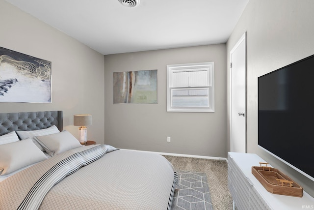 bedroom featuring carpet flooring, visible vents, and baseboards