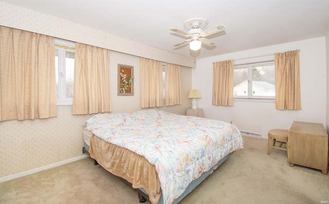 carpeted bedroom featuring baseboards and wallpapered walls