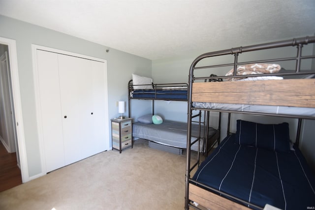 bedroom with a closet and carpet flooring