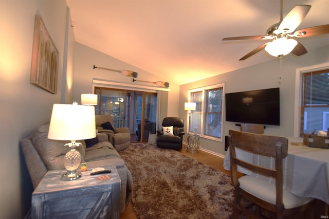 living room featuring lofted ceiling and ceiling fan