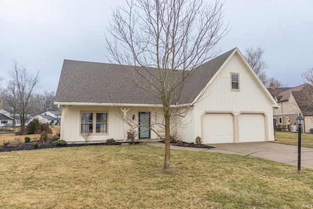 view of front of home featuring a garage, a front yard, concrete driveway, and roof with shingles