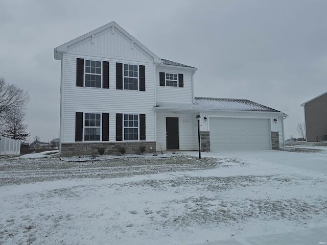 view of front of property with board and batten siding, stone siding, and a garage