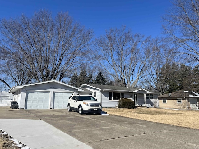 view of front of property featuring a garage and driveway