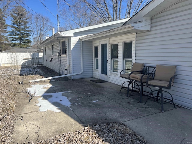 view of patio featuring fence