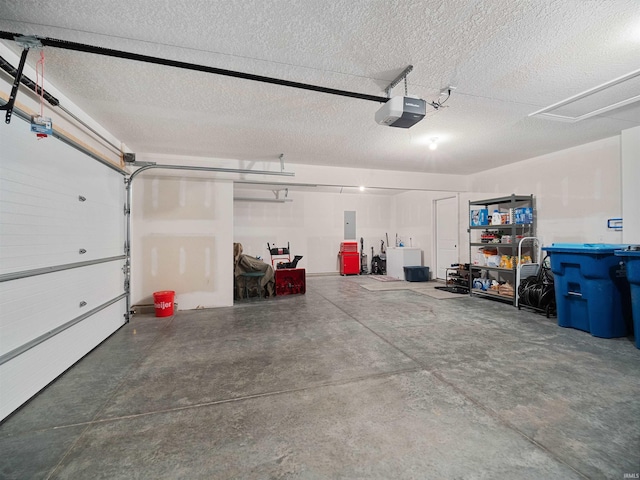 garage featuring a garage door opener and electric panel