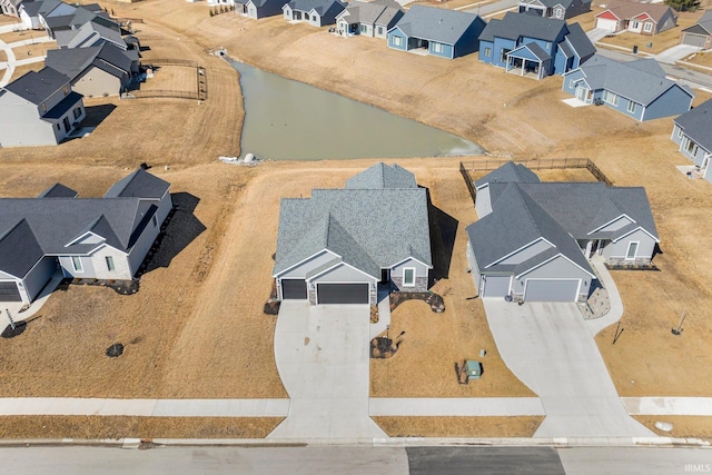 aerial view featuring a water view and a residential view