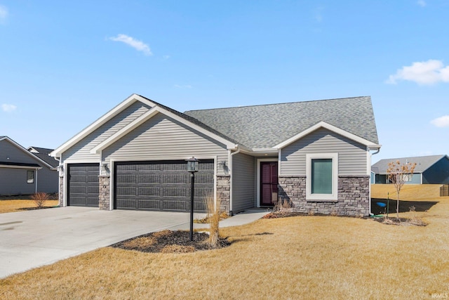 single story home with an attached garage, driveway, roof with shingles, and a front yard