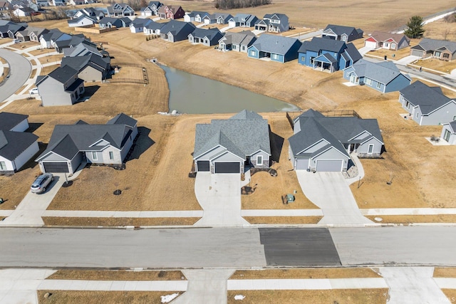 aerial view with a water view and a residential view