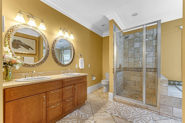 full bathroom featuring toilet, crown molding, a sink, and a shower stall