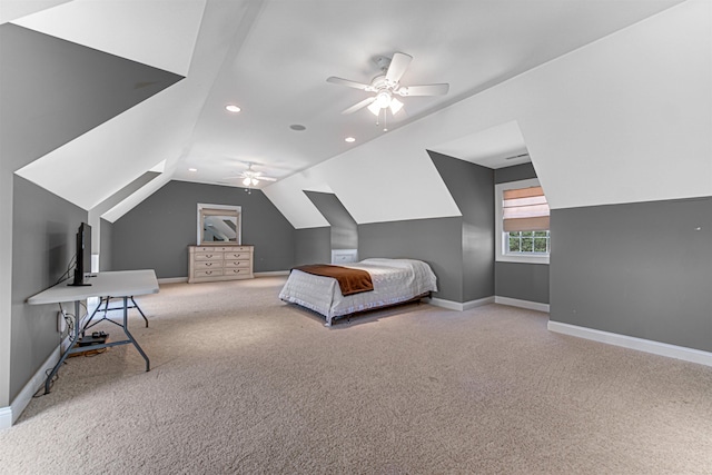 bedroom featuring carpet floors, vaulted ceiling, baseboards, and ceiling fan