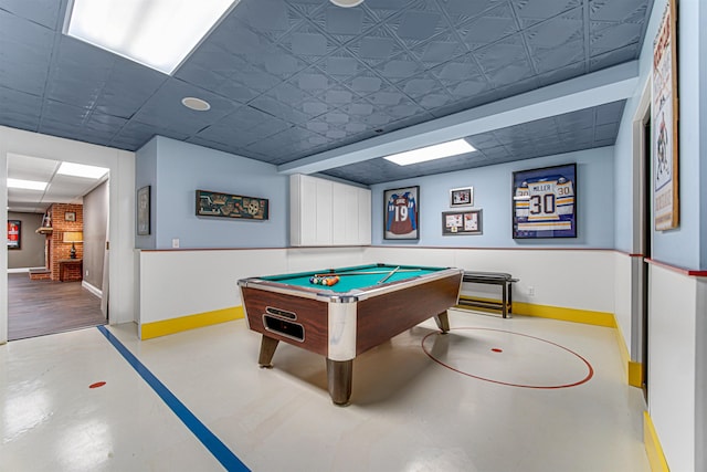 recreation room with concrete flooring, billiards, and baseboards