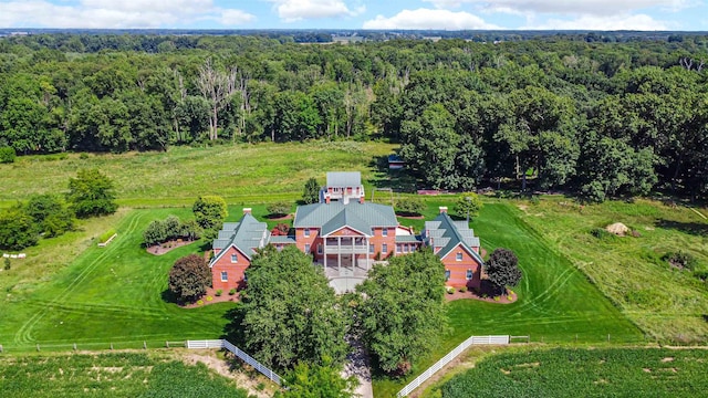 drone / aerial view featuring a forest view