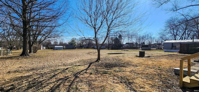 view of yard with an outdoor structure