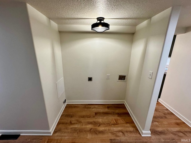 clothes washing area featuring hookup for a washing machine, laundry area, electric dryer hookup, and wood finished floors