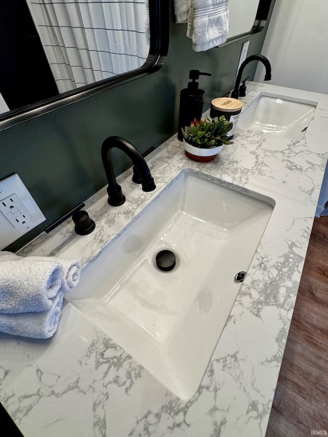 interior details with a sink and double vanity