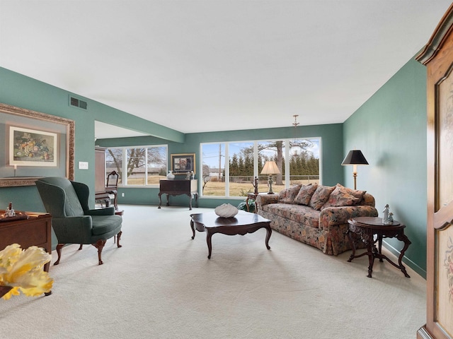 living area with carpet flooring and visible vents