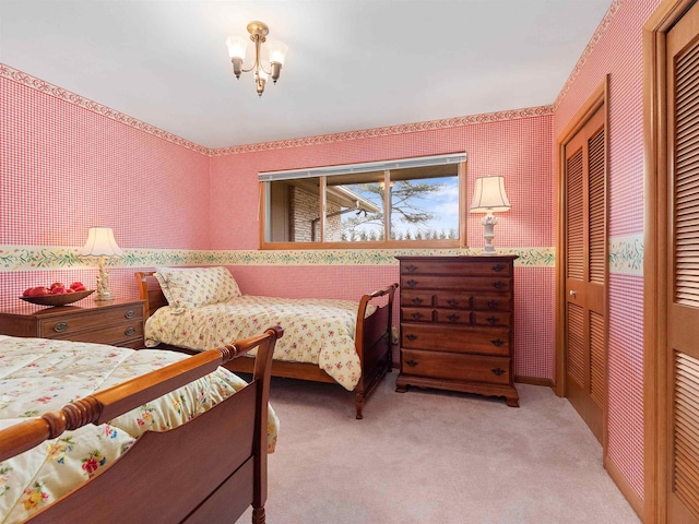 carpeted bedroom with wallpapered walls