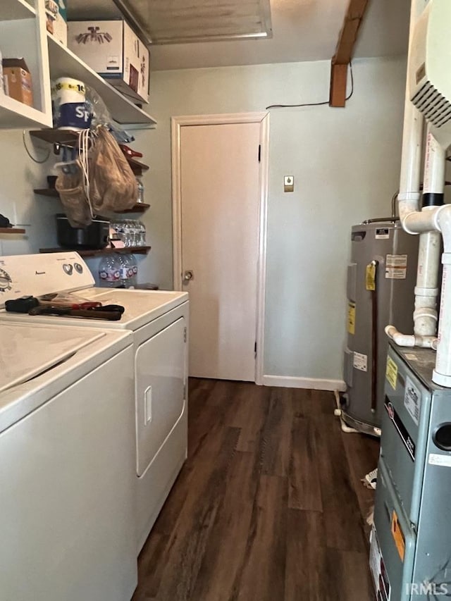 laundry room with laundry area, water heater, dark wood-style flooring, and washer and dryer